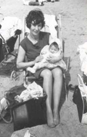 Mary Dolly poses for photo on the beach